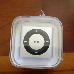 Brand new 2GB iPod shuffle, earphones, USB cable